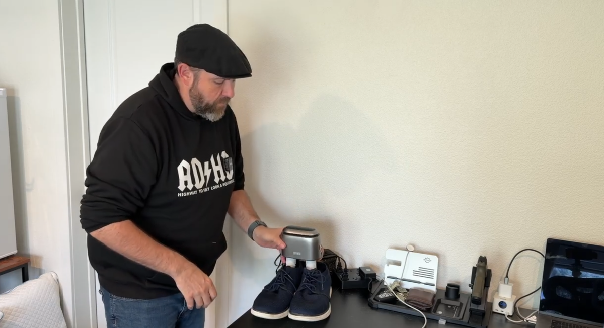 Creator using the SOTHING Ultra Boot Dryer with a pair of shoes